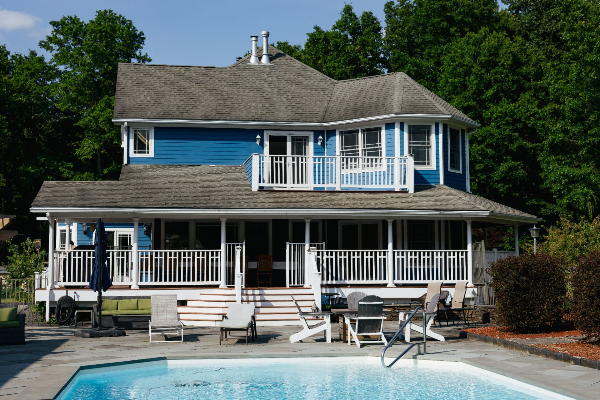 The farmhouse and pool at Little Logan's Farm, home of The Wild Lux